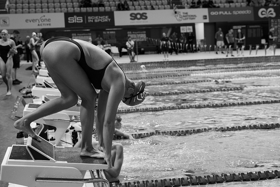Swimmer at the London Aquatics Centre, Queen Elizabeth Olympic Park. Training session during Aquatics GB Swimming Championships 2025. Movement photographer Simon Tomkinson.